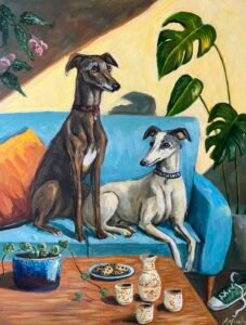 a painting of one brown and one white greyhound dog sitting on a blue sofa with an orange cushion. in front is a table with a plate of cookies and a string of hearts plant in a blue planter. in the background is a spotted begonia and a monstera plant.